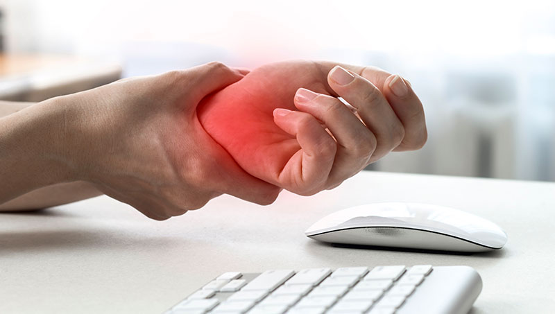 Patient suffering from carpal tunnel syndrome due to typing