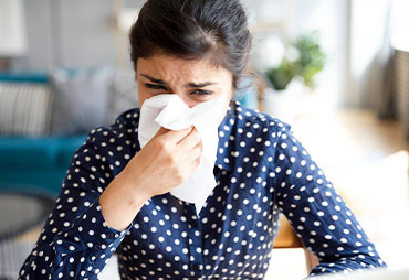 Woman suffering with severe allergies