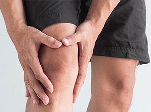 Man suffering with from knee pain